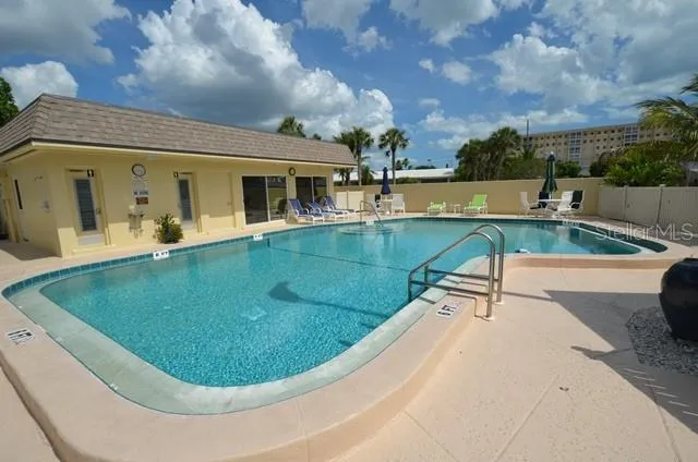 a view of a swimming pool with a patio