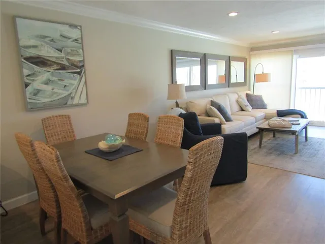 a view of a dining room with furniture and window