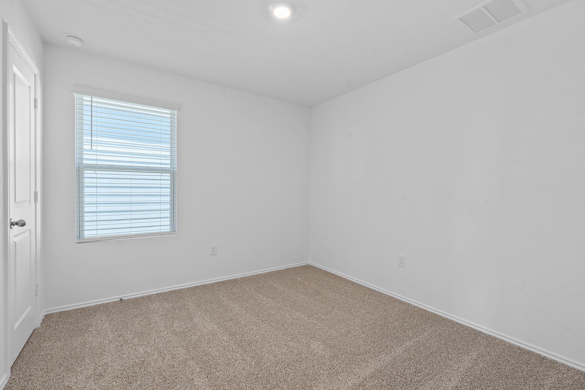 13309 Mancos Shale Road Mustang Ridge, TX 78610 - Photo 12 of 19 an empty room with a window