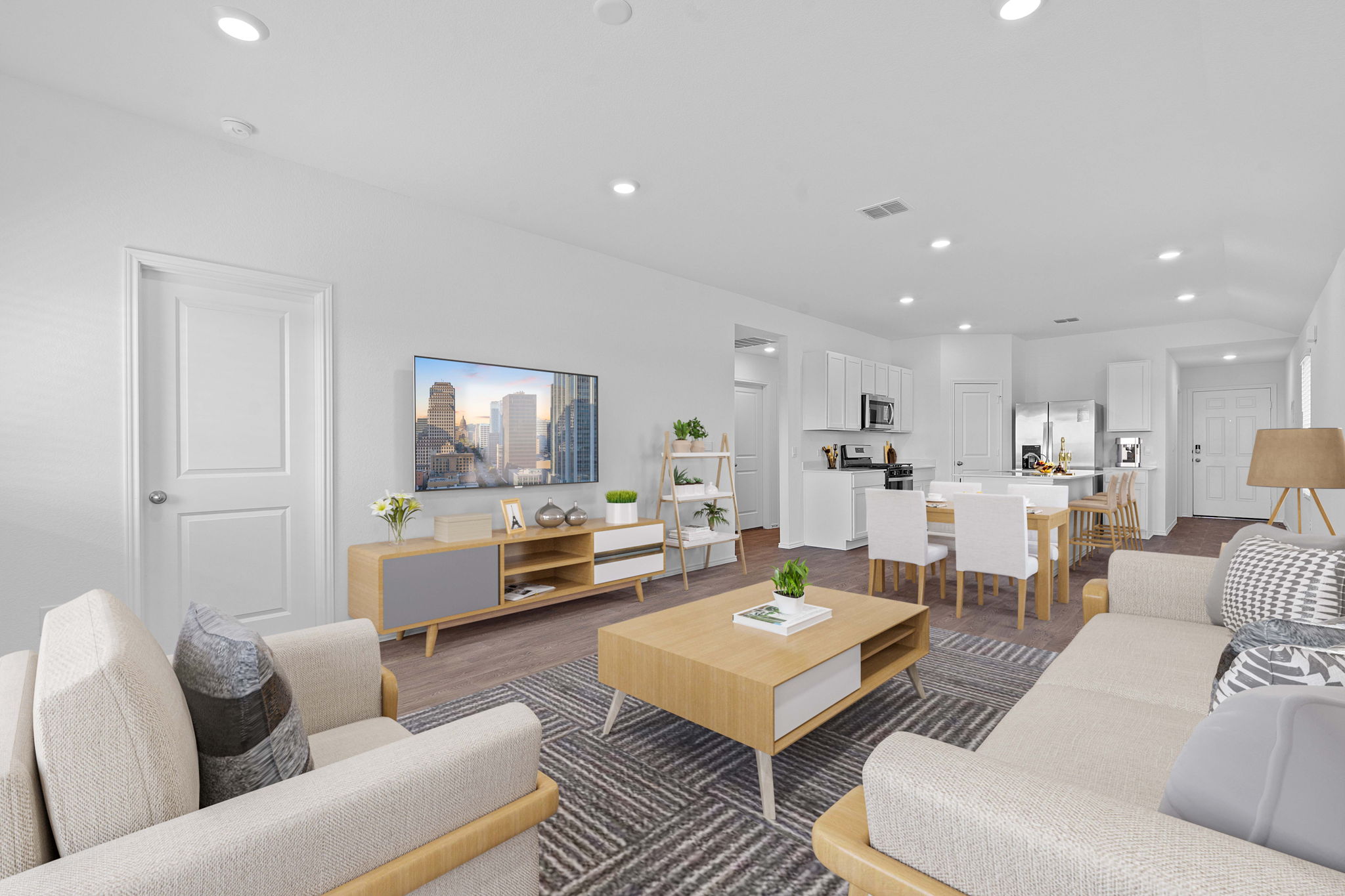 13309 Mancos Shale Road Mustang Ridge, TX 78610 - Photo 2 of 19 a living room with furniture and a wooden floor