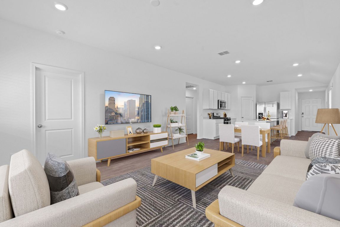 13309 Mancos Shale Road Mustang Ridge, TX 78610 - Photo 2 of 19 Living room with recessed lighting and dark wood finished floors