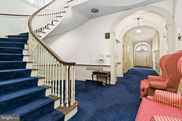 a view of entryway with wooden floor and stairs