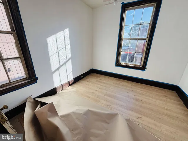 a view of an empty room with windows