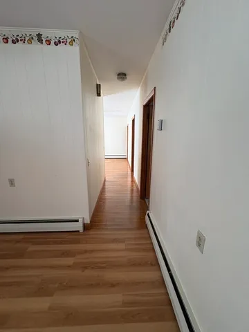 a view of a livingroom with wooden floor