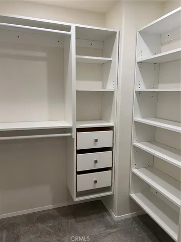 a view of an empty walk in closet