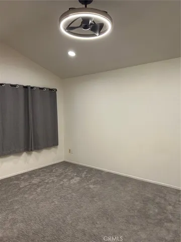 a view of an empty room and garage