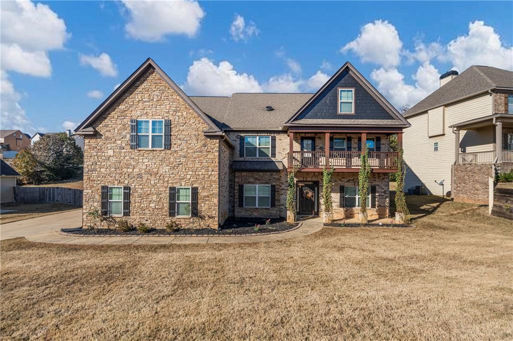 a front view of a house with a yard