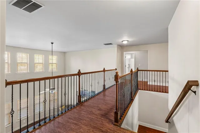 a view of hallway with wooden floor