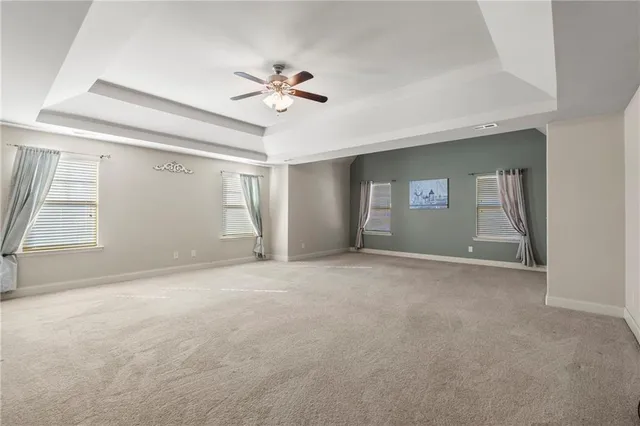 a view of an empty room with windows