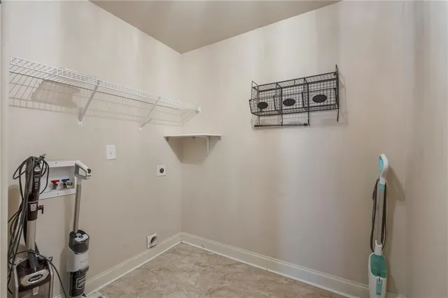 a view of a storage and utility room with racks on the wall