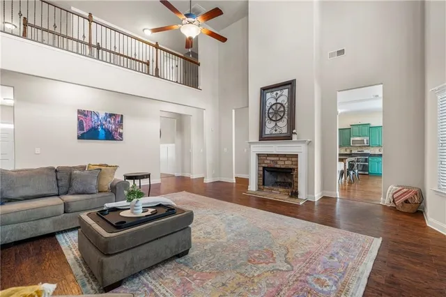 a living room with furniture and a fireplace