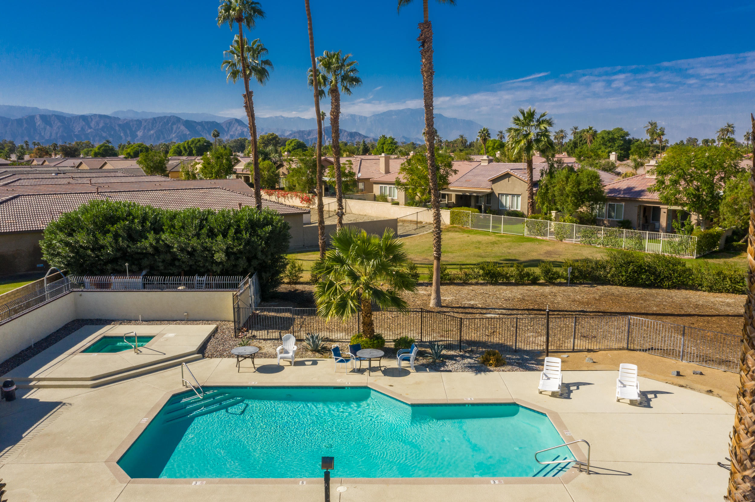 49058 Wayne Street Indio, CA 92201 - Photo 14 of 26 a view of swimming pool with outdoor seating and plants