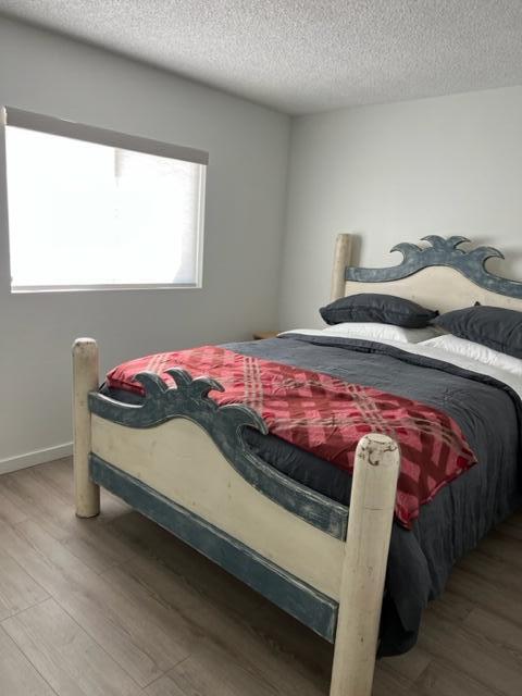 49058 Wayne Street Indio, CA 92201 - Photo 17 of 26 a bedroom with a bed and a window