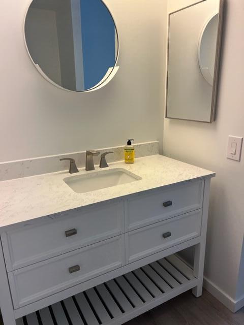 49058 Wayne Street Indio, CA 92201 - Photo 18 of 26 a bathroom with a sink and a mirror
