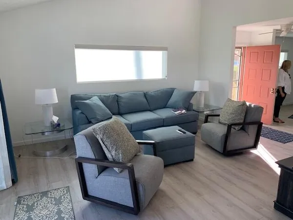 a bedroom with a bed and a lamp on table