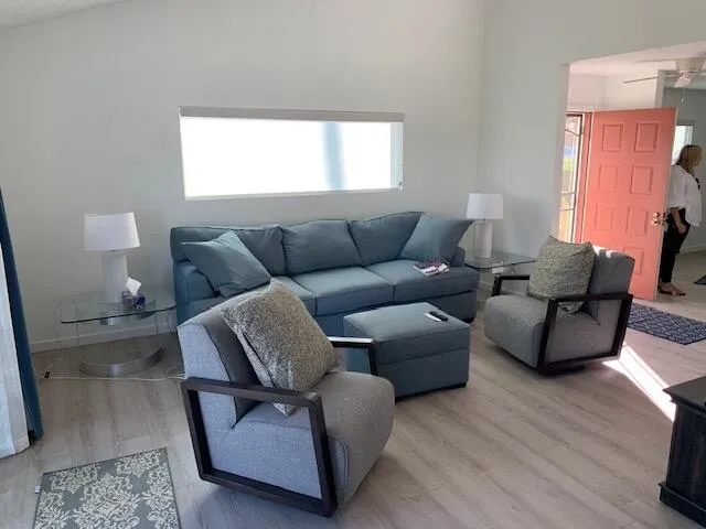 a bedroom with a bed and a lamp on table