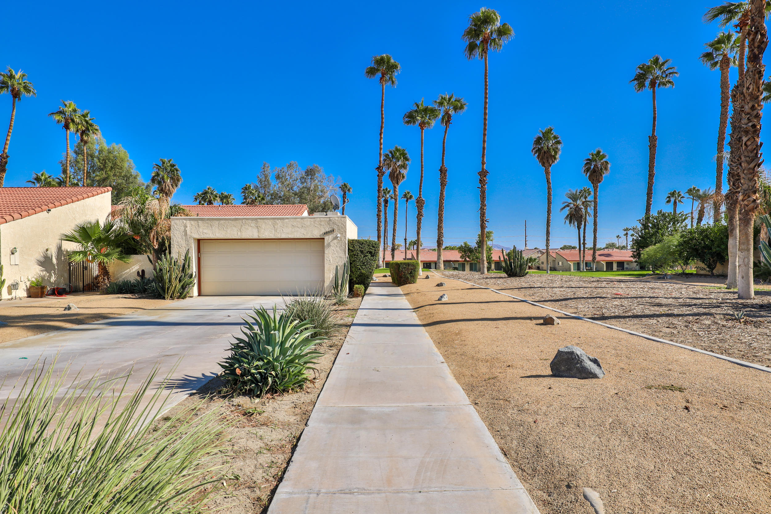 49058 Wayne Street Indio, CA 92201 - Photo 9 of 26 front view of a house with a yard
