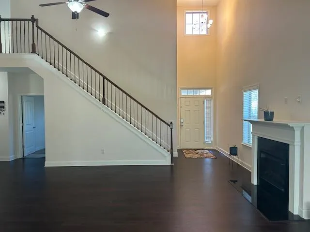 a view of entryway and hall with wooden floor
