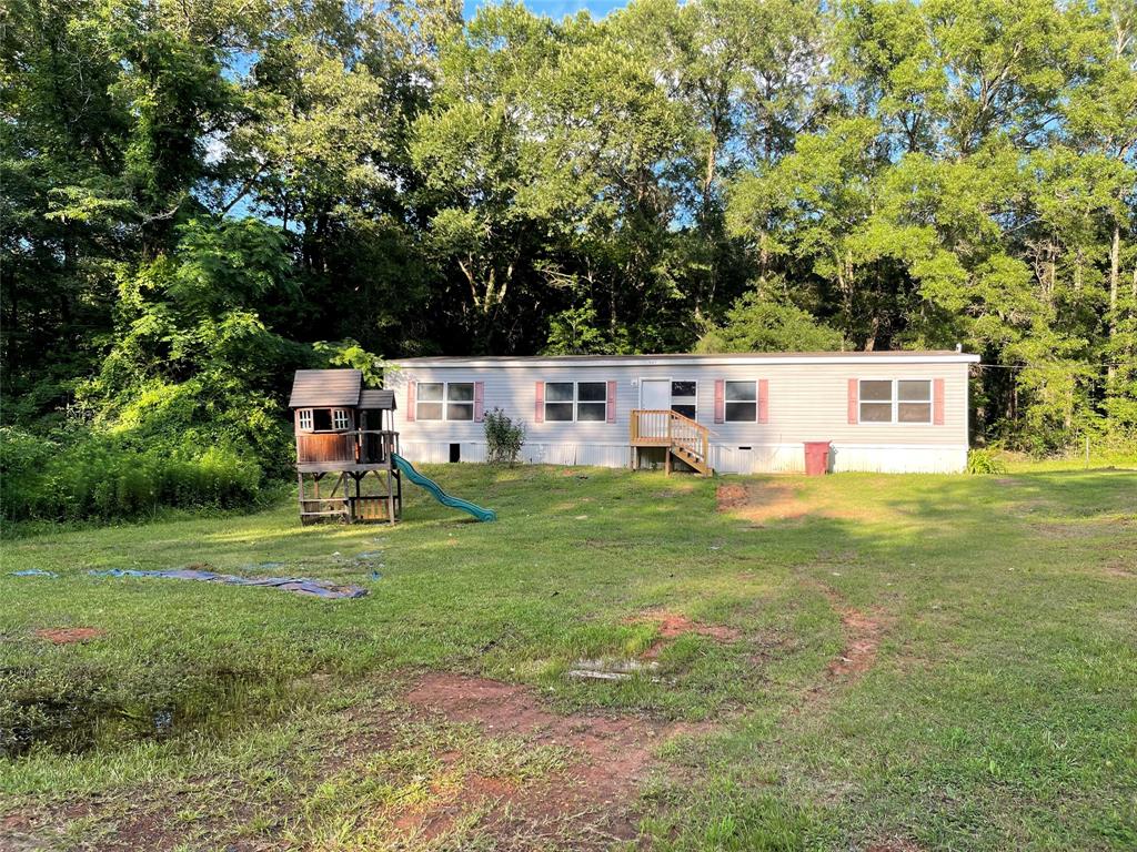907 Ridge Road Castor, LA 71016 - Photo 3 of 25 a view of a house with a backyard
