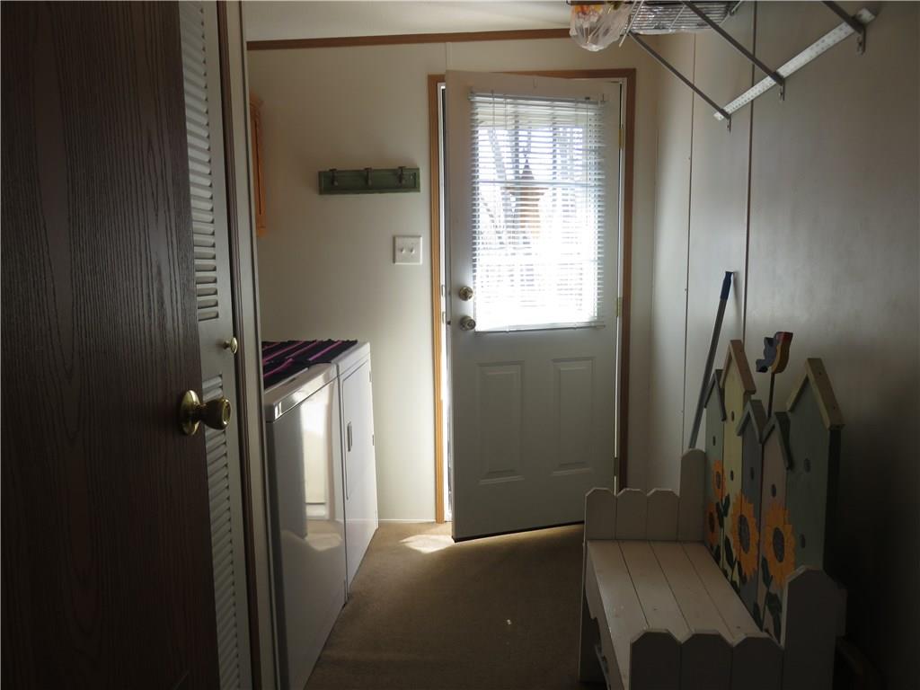 206 Sunbury Road Slippery Rock, PA 16057 - Photo 12 of 24 The laundry room is on the main floor and has a door to the back porch.