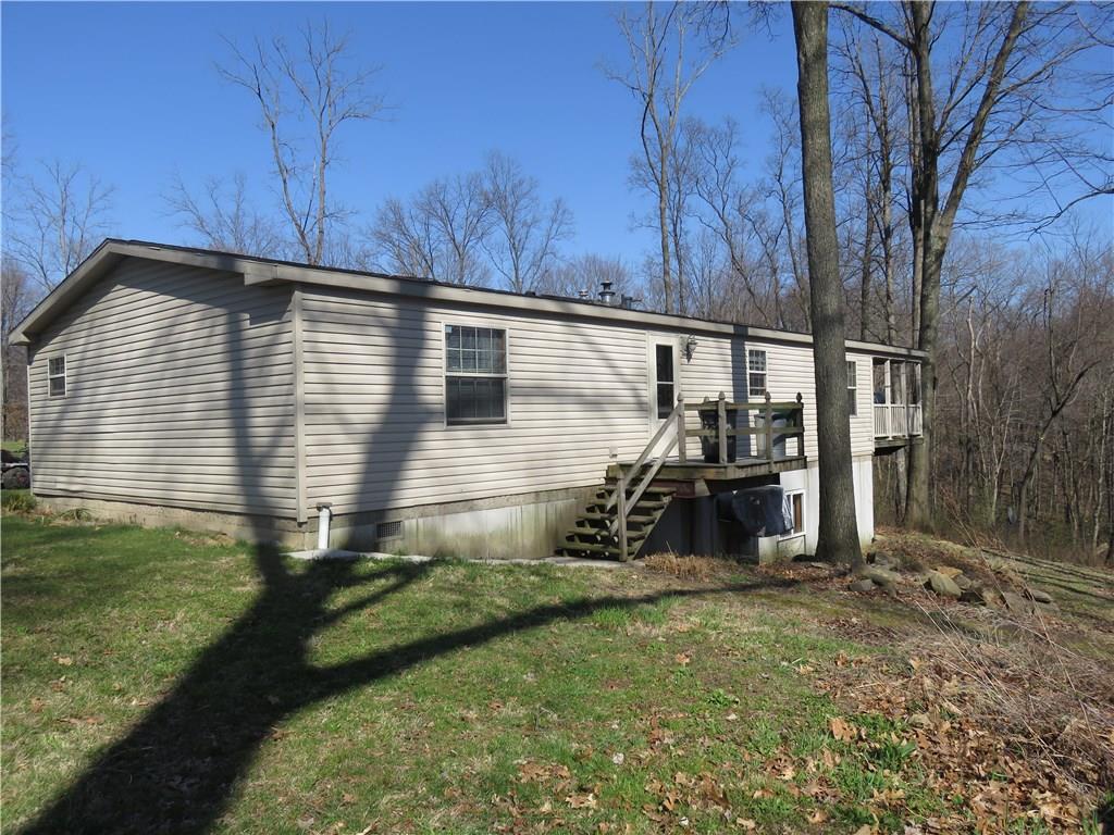 206 Sunbury Road Slippery Rock, PA 16057 - Photo 21 of 24 The view of the back of the house shows the back porch off the laundry room.