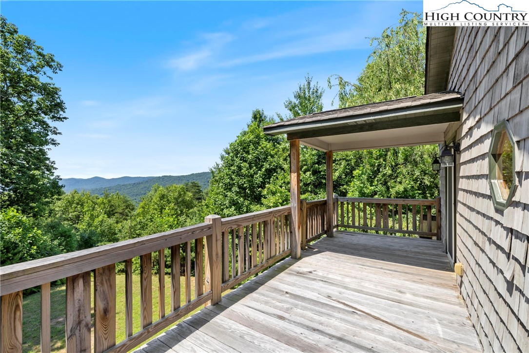 207 Carters Lane Purlear, NC 28665 - Photo 24 of 50 a balcony with wooden floor and outdoor space