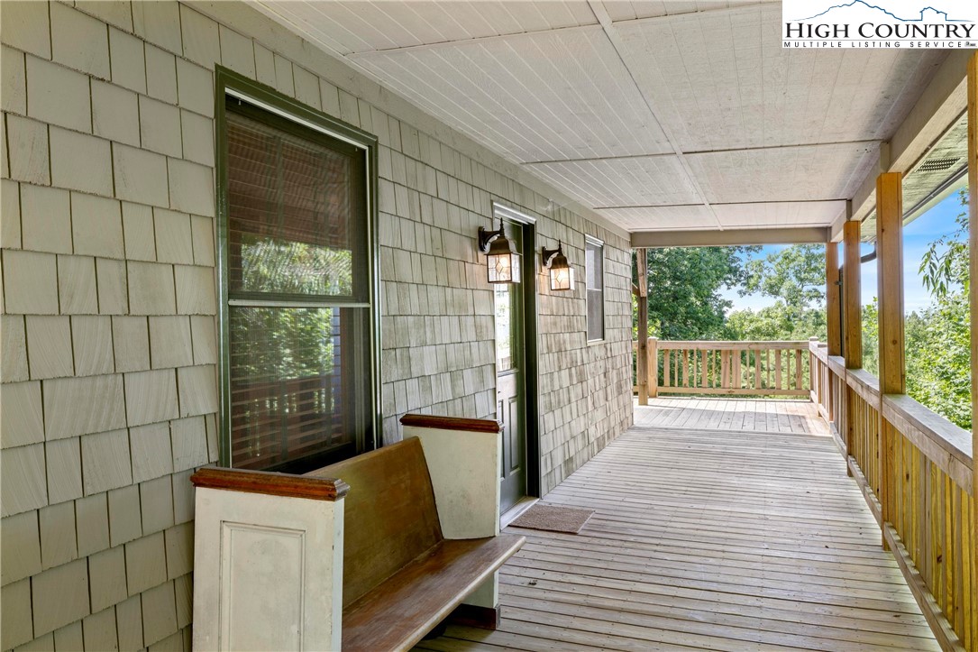 207 Carters Lane Purlear, NC 28665 - Photo 5 of 50 a view of a balcony with wooden floor
