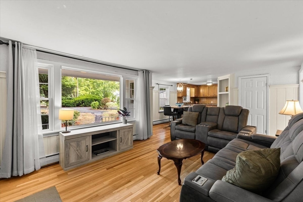 85 Maple Street Bourne, MA 02532 - Photo 11 of 42 a living room with furniture and a open kitchen view