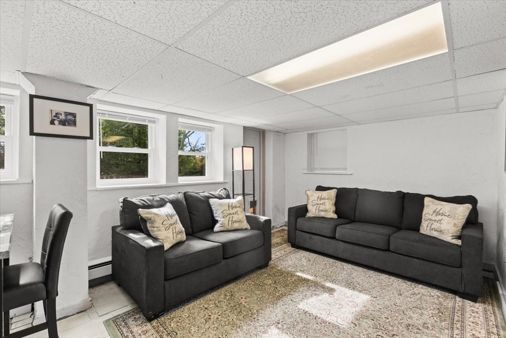 85 Maple Street Bourne, MA 02532 - Photo 28 of 42 a living room with furniture and a couch