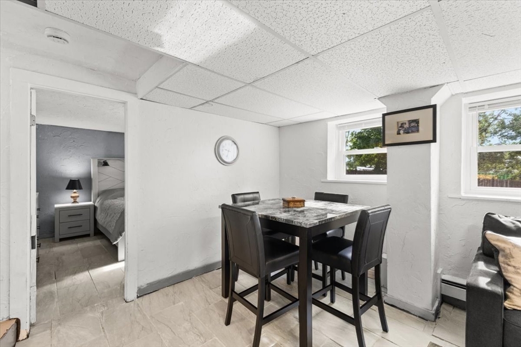 85 Maple Street Bourne, MA 02532 - Photo 29 of 42 a view of a dining room with furniture and a window