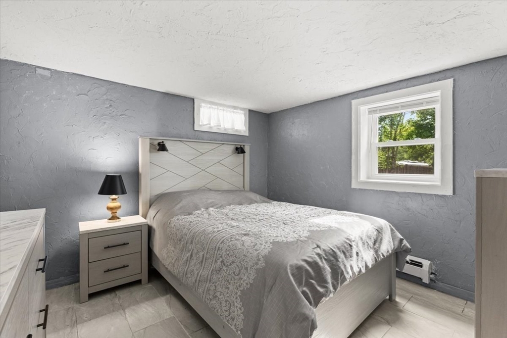 85 Maple Street Bourne, MA 02532 - Photo 32 of 42 a bedroom with a bed and a window