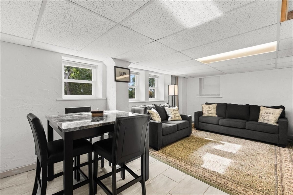 85 Maple Street Bourne, MA 02532 - Photo 34 of 42 a living room with furniture and a table