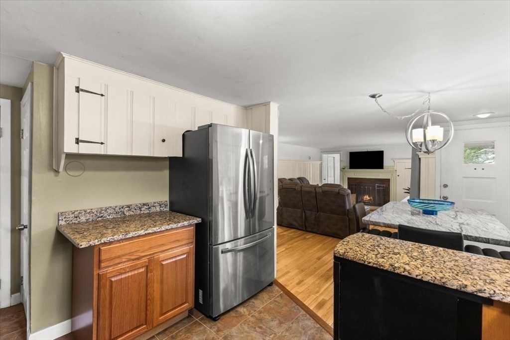 85 Maple Street Bourne, MA 02532 - Photo 6 of 42 a kitchen with stainless steel appliances granite countertop a refrigerator a oven a sink a stove and a refrigerator