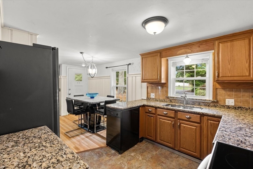 85 Maple Street Bourne, MA 02532 - Photo 7 of 42 a kitchen with a sink and cabinets