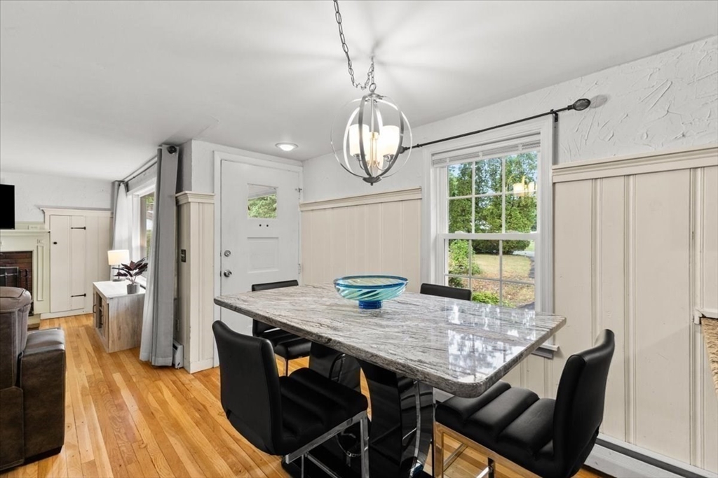 85 Maple Street Bourne, MA 02532 - Photo 10 of 42 a view of a dining room with furniture window and wooden floor