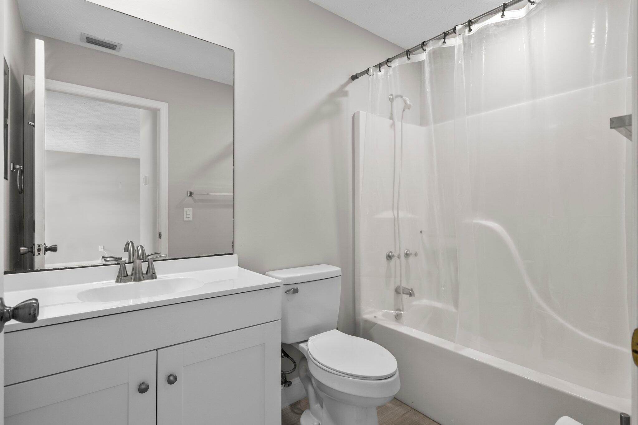 5712 Spindle Place Fort Pierce, FL 34982 - Photo 14 of 35 a bathroom with a sink toilet and shower