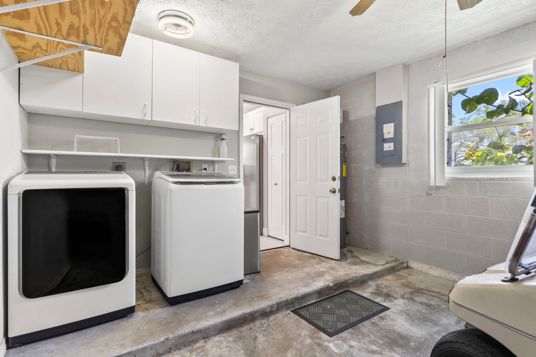 5712 Spindle Place Fort Pierce, FL 34982 - Photo 15 of 35 a kitchen with stainless steel appliances a refrigerator a stove a microwave and sink