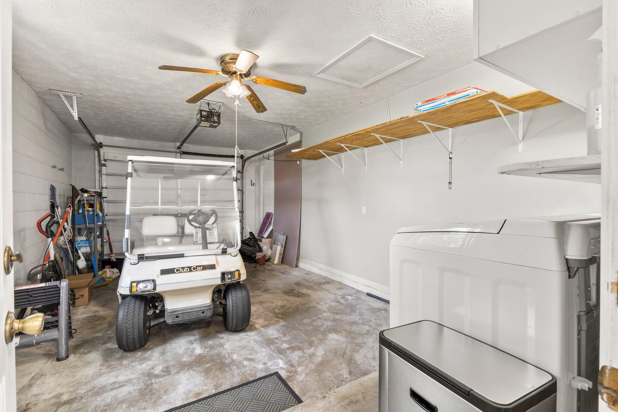 5712 Spindle Place Fort Pierce, FL 34982 - Photo 16 of 35 a bedroom with a bed and a chandelier