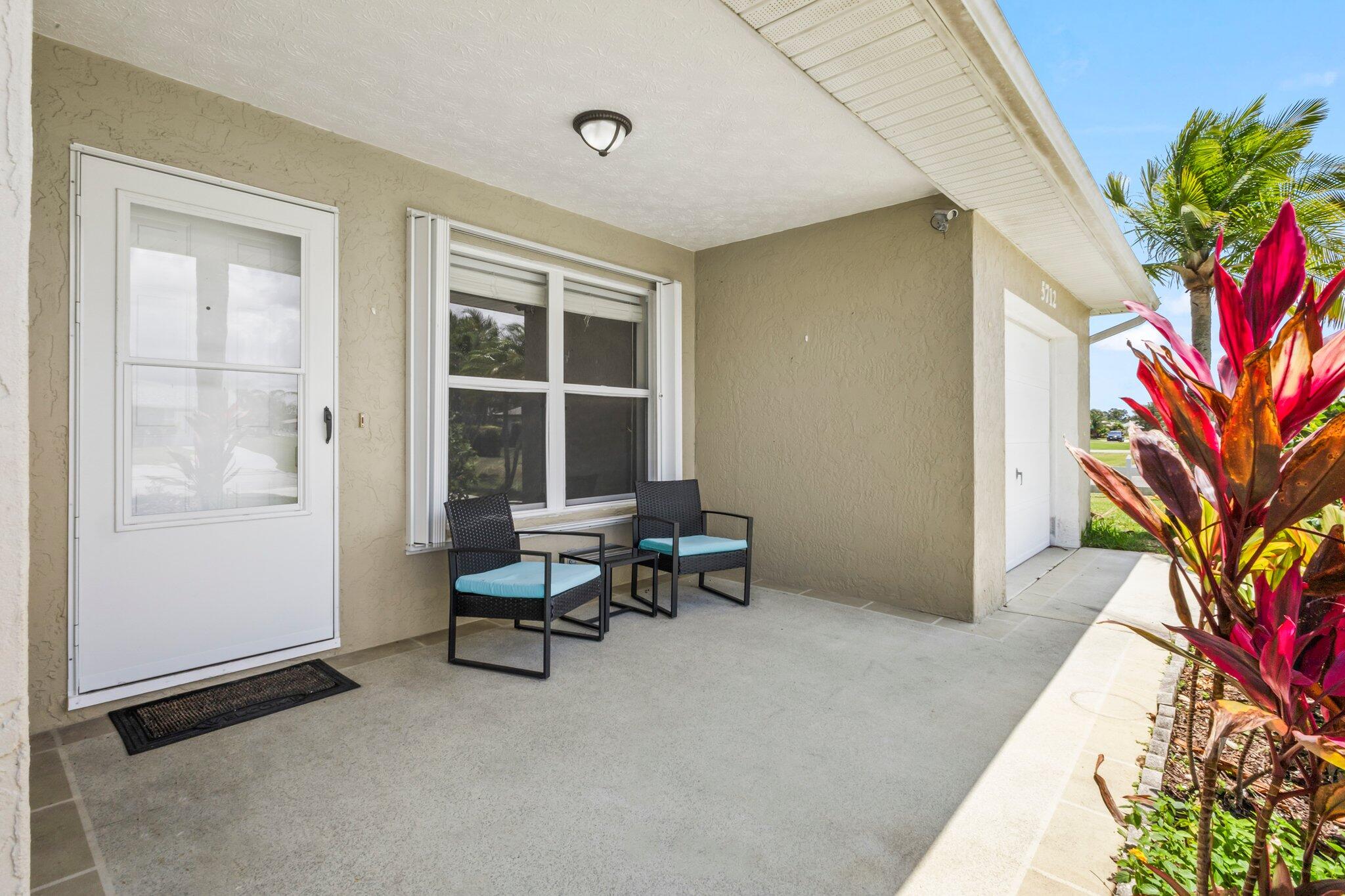 5712 Spindle Place Fort Pierce, FL 34982 - Photo 19 of 35 a living room with furniture and a potted plant