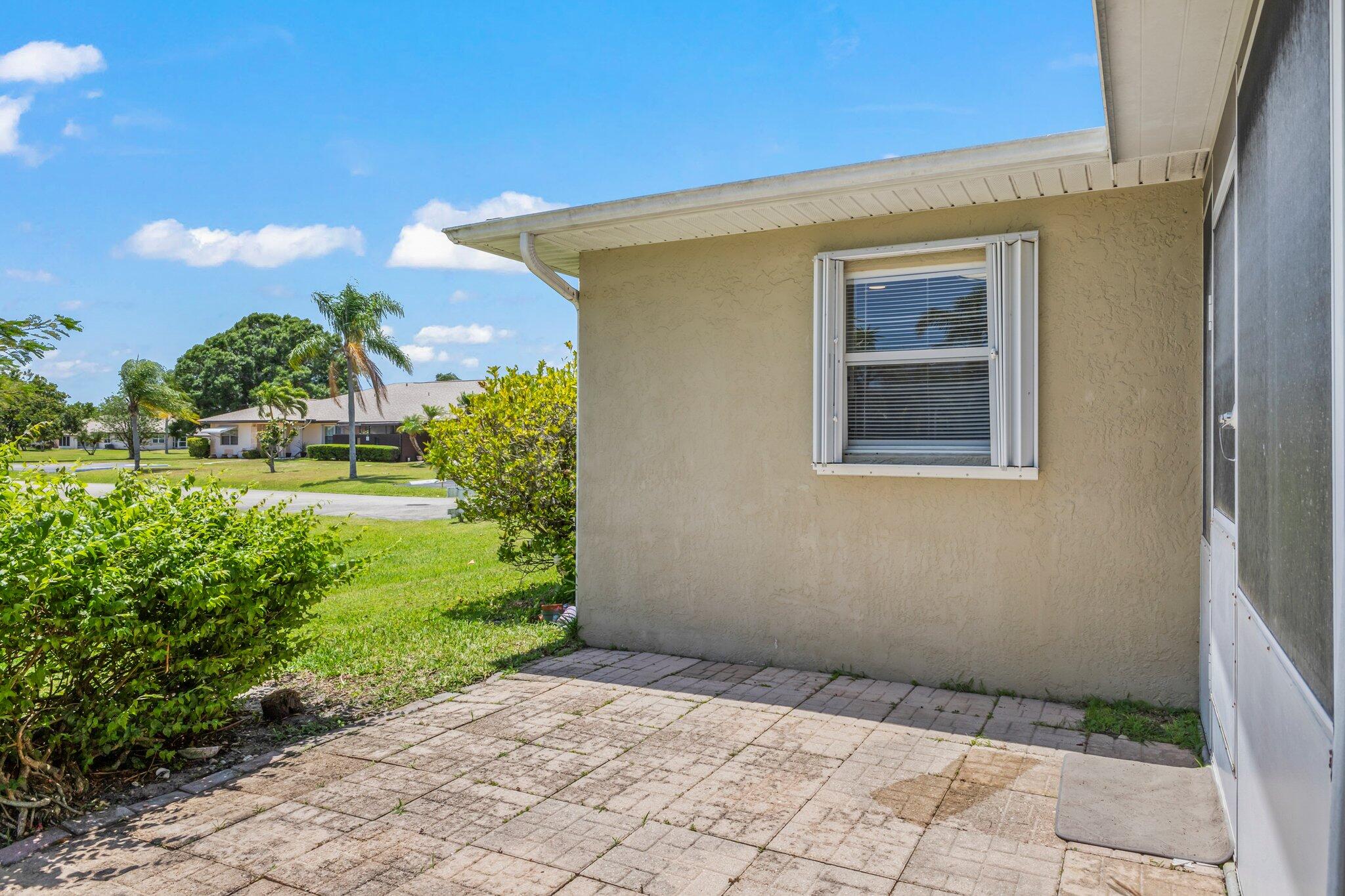 5712 Spindle Place Fort Pierce, FL 34982 - Photo 22 of 35 a view of backyard with plants and outdoor seating