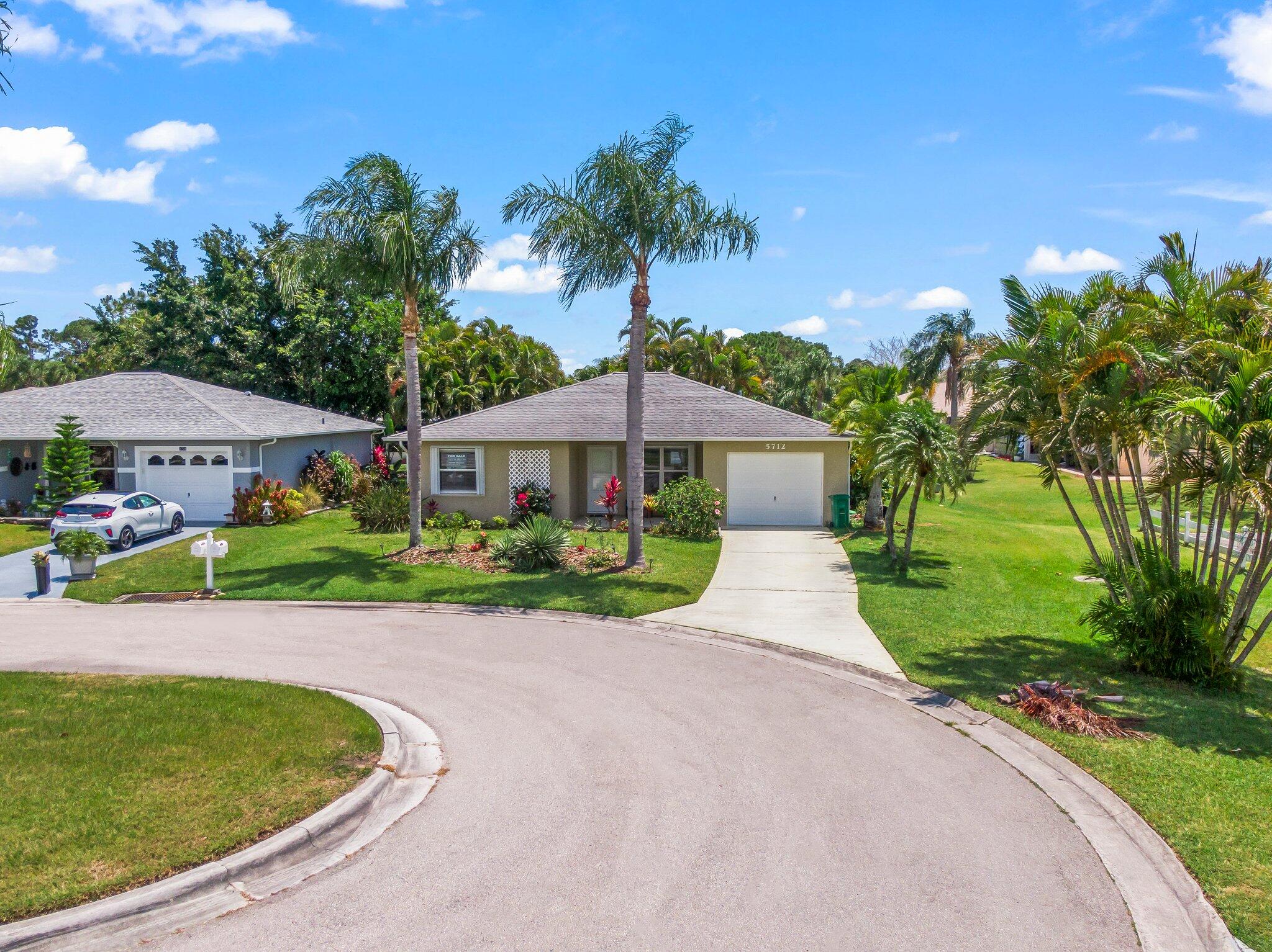 5712 Spindle Place Fort Pierce, FL 34982 - Photo 28 of 35 a front view of house with yard and green space