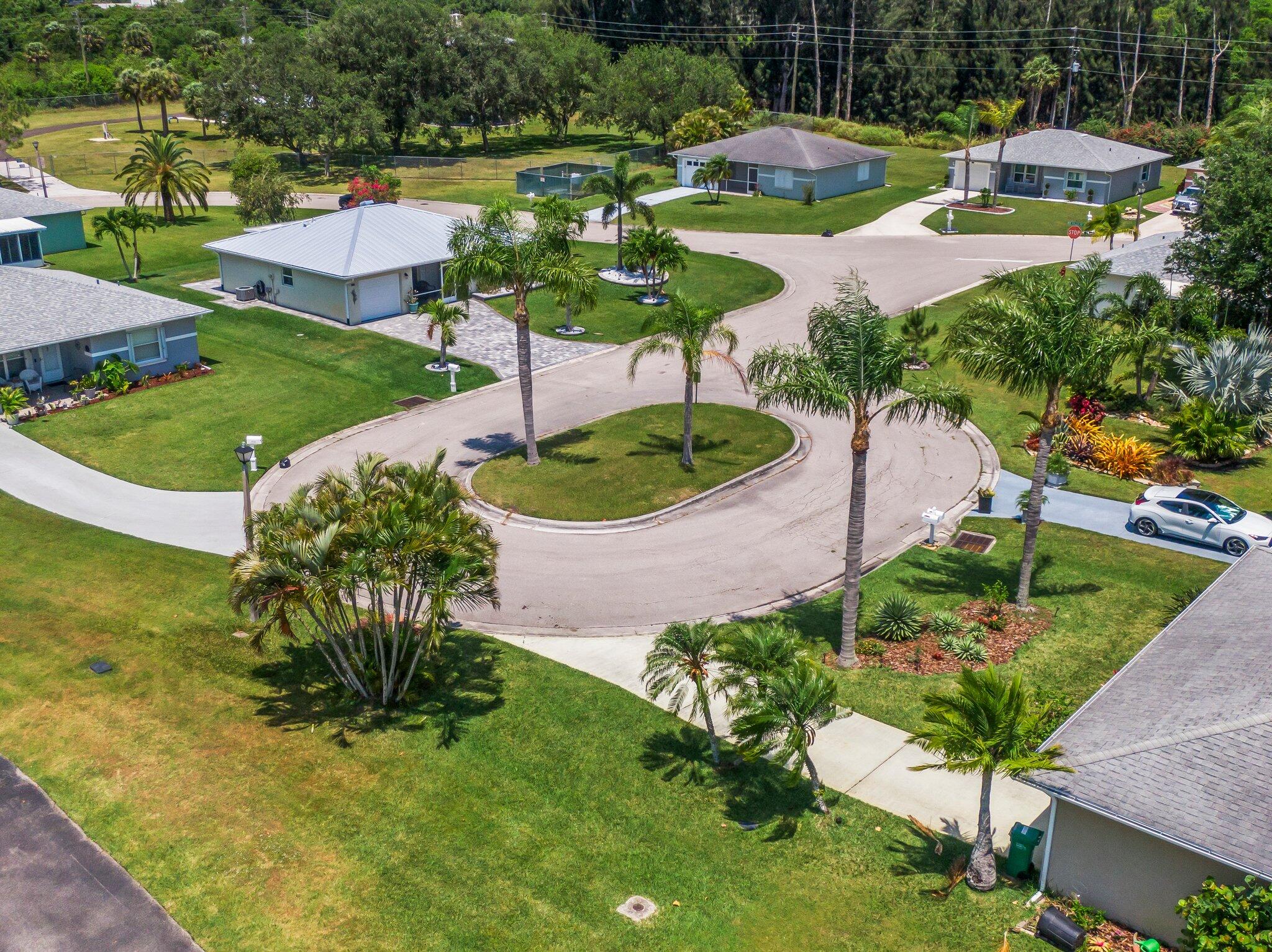 5712 Spindle Place Fort Pierce, FL 34982 - Photo 33 of 35 an aerial view of a house with garden space and lake view