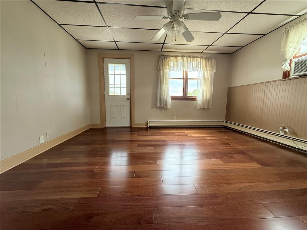 1111 Schang Road Pittsburgh, PA 15236 - Photo 4 of 12 an empty room with wooden floor and windows