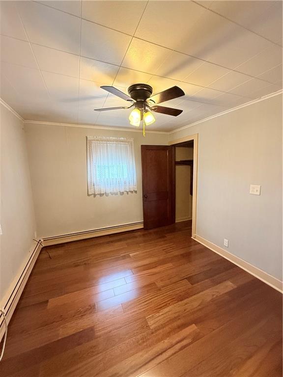 1111 Schang Road Pittsburgh, PA 15236 - Photo 6 of 12 a view of an empty room with window and wooden floor