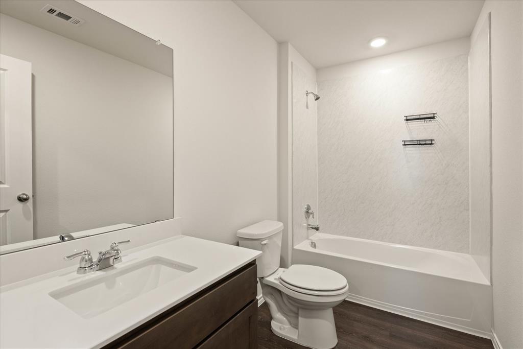 3117 Pr Hl Grove Crandall, TX 75114 - Photo 12 of 16 a bathroom with a sink a toilet and shower