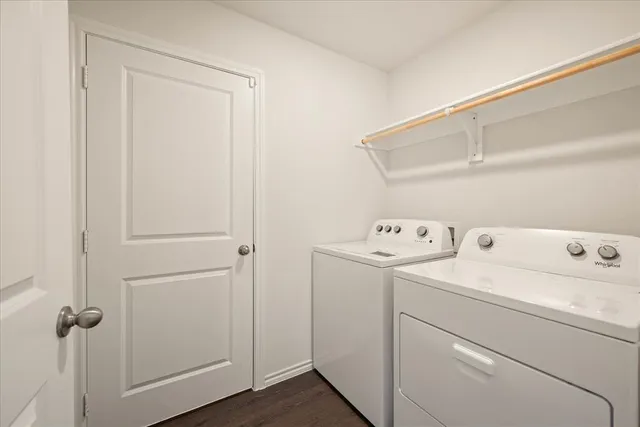 a view of storage and utility room with washer and dryer