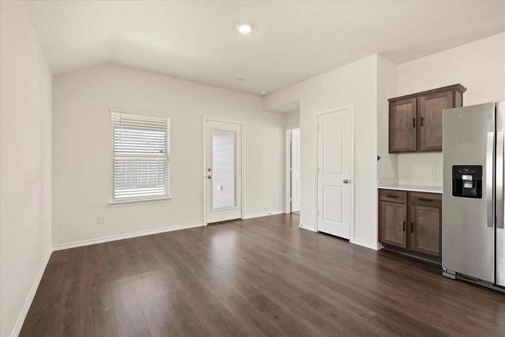 3117 Pr Hl Grove Crandall, TX 75114 - Photo 6 of 16 a view of an empty room with a kitchen and a window