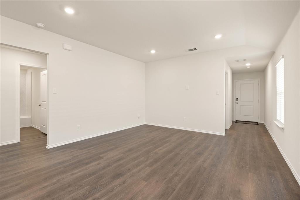 3117 Pr Hl Grove Crandall, TX 75114 - Photo 7 of 16 a view of an empty room with wooden floor