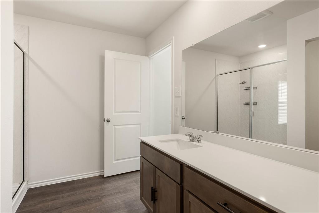 3117 Pr Hl Grove Crandall, TX 75114 - Photo 10 of 16 a bathroom with a sink and a mirror