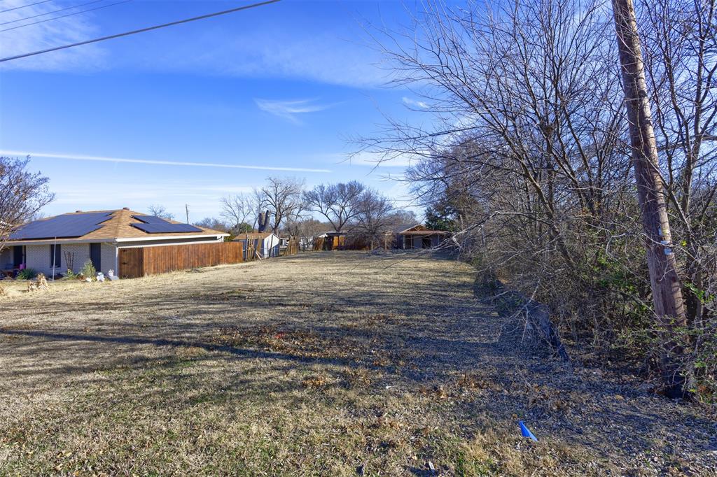 2407 3rd Street Sachse, TX 75048 - Photo 8 of 10 a view of dirt yard with a large tree
